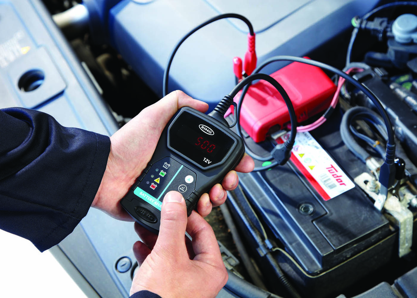 RBA50 connected to battery and being used by technician